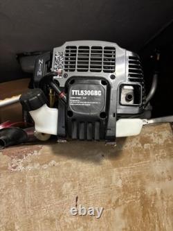 Coupe-bordures à essence Titan TTL530GBC avec accessoires en bon état de fonctionnement